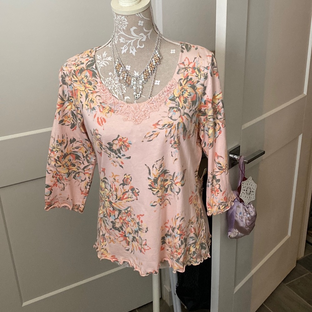 A beautiful peach top that looks great with jeans.